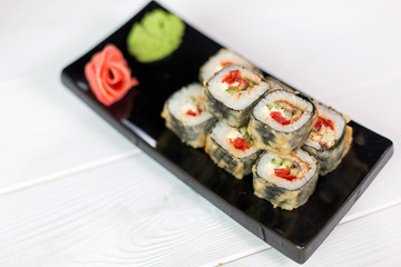 Sushi and rolls on black plate. Sea healthy japanese asian food