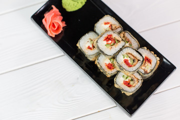 Sushi and rolls on black plate. Sea healthy japanese asian food