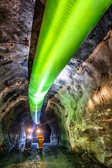 Miners inspecting an underground ventilation system in a gold mine in Australia