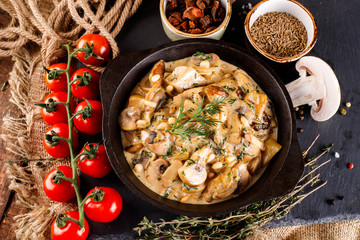 Mushrooms in cream sauce, julienne, champignon, products for cooking on the background of shale black Board © Aleksei Zakharov
