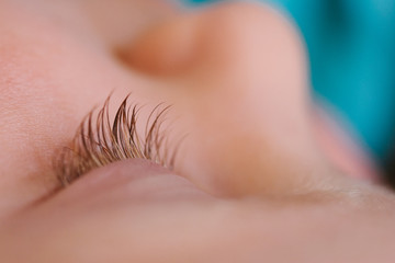 Fototapeta premium Close up of a young todder girl's eyelashes