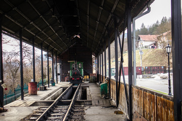 Old railroad station with narrow gauge railway track, popular tourist attraction known as sarganska...