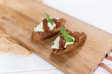 Bruschetta with cheese cream and tomatoes. Food photo for menu