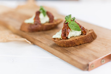 Bruschetta with cheese cream and tomatoes. Food photo for menu