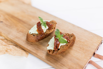 Bruschetta with cheese cream and tomatoes. Food photo for menu