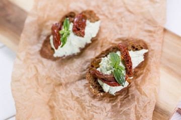 Bruschetta with cheese cream and tomatoes