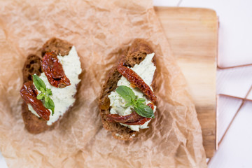 Bruschetta with cheese cream and tomatoes