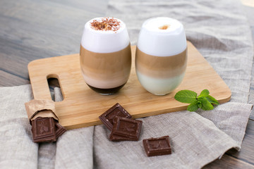 Hot drink in cups. Coffee latte cappucino and cacao. Photo fot menu