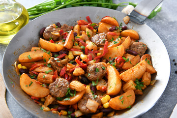 Vegetables from the pan with meat chunks