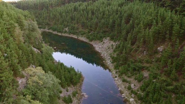 Aerial drone view of a shallow lake inside a small canyon (Tirpentwys and Blaencuffin, Wales)