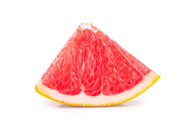 Grapefruit slice isolated on white background closeup