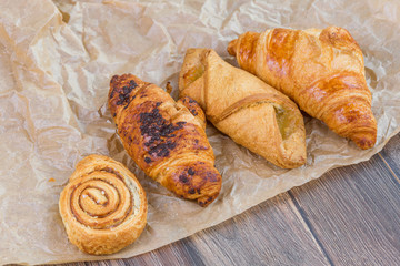 Sweet breakfast concept. Baked croissants on wooden table