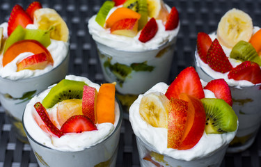 fresh health fruit dessert with fruit and sour cream