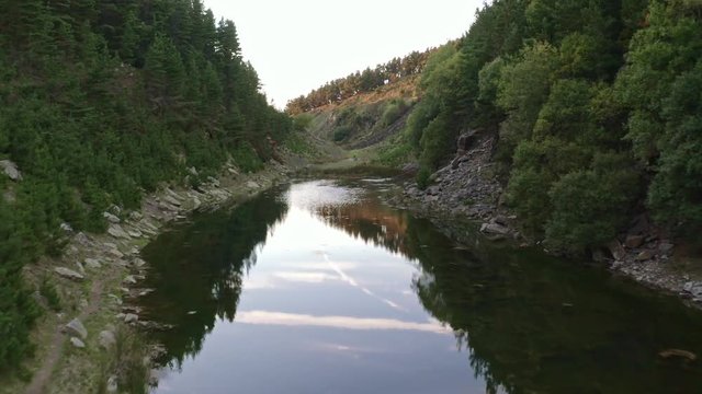 Aerial drone view of a shallow lake inside a small canyon (Tirpentwys and Blaencuffin, Wales)