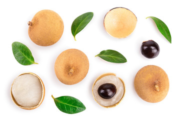 Fresh longan fruit with leaves isolated on white background. Top view. Flat lay
