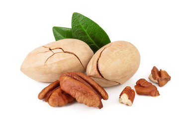 pecan nut with green leaves isolated on white background