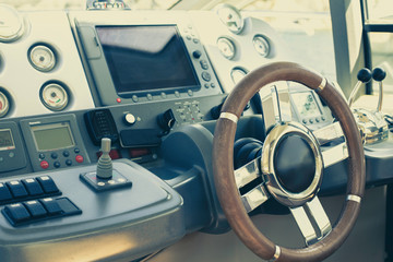 Steering wheel and control panel on a luxury yacht