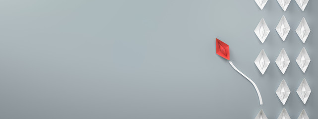 paper boat leadership lead management concept - red paper boat leading the row