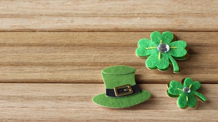 St Patrick's Day objects laying flat on a wood background with writing space