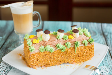 Delicious cake with coffee latte on wooden table