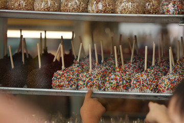 candy apples with sprinkles at the fair