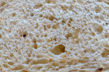 The structure of natural organic porous bread for the background, macro shot