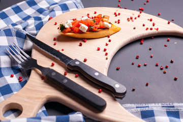 sandwich on a blackboard with a knife cutter