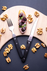 sandwich on a blackboard with a knife cutter