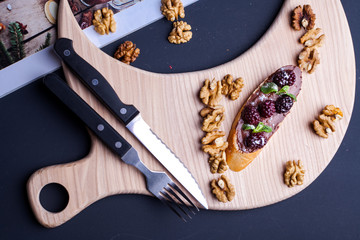 sandwich on a blackboard with a knife cutter