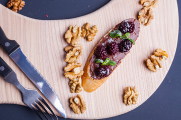 sandwich on a blackboard with a knife cutter