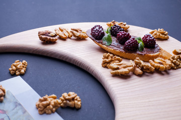 sandwich on a blackboard with a knife cutter