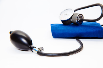 A blood pressure monitor to measure blood pressure. Manual pressure gauge with pump for air...