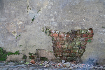 Plaster Missing from Wall Showing Brickwork Underneath