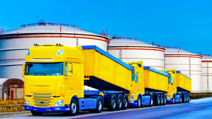 On the road a car for transportation of grain . the yellow truck with the trailer . Agricultural...