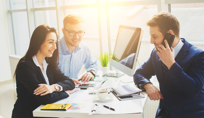 Fototapeta premium Successful business team with arms crossed at the office