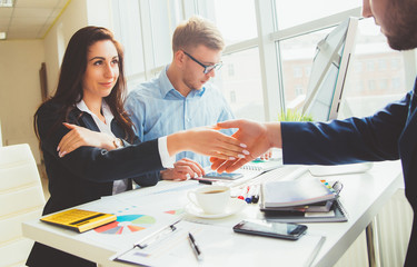Successful business team with arms crossed at the office