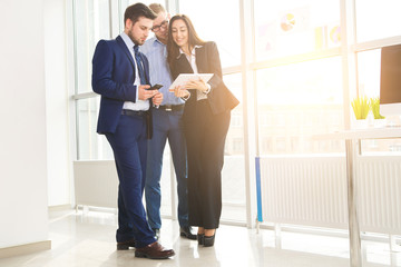 Fototapeta premium Successful business team with arms crossed at the office