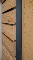 Cross section and profile of wood frame construction with solid timber and insulating wooden wool