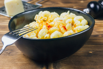 Classic Homemade Macaroni and Cheese on black bowl