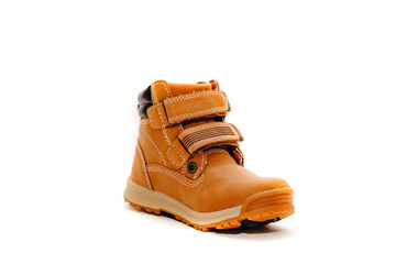 A pair of small leather shoe isolated on a white background. Warm, fur-lined children's shoes with laces. Concept of the coming autumn and winter.