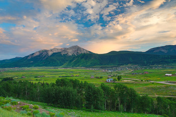 Crested Butte, Colorado, big sky country over green valley