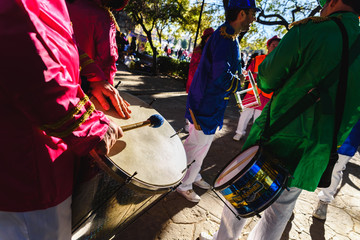 Valencia, Spain - February 16, 2019: Group of drummers of a Spanish batukada making their drums boom through the streets of the Ruzafa district during their carnival.