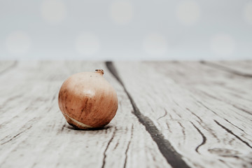 Onions isolated on wooden background. The concept of using vegetables for preparing meals. Using onions to eat. The concept of adding spices for taste.