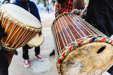 Fototapeta na wymiar African drummers blowing their bongos on the street.