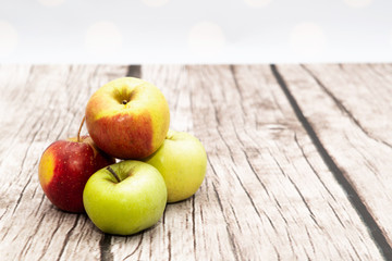 Fresh red apples on wooden. Delicious apples lie on the table. The concept of providing vitamins along with fruits. Eating fruit on a daily basis.