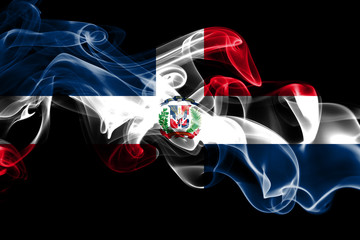 National flag of Dominican Republic made from colored smoke isolated on black background. Abstract...