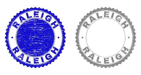 Obraz premium Grunge RALEIGH stamp seals isolated on a white background. Rosette seals with grunge texture in blue and grey colors. Vector rubber watermark of RALEIGH title inside round rosette.