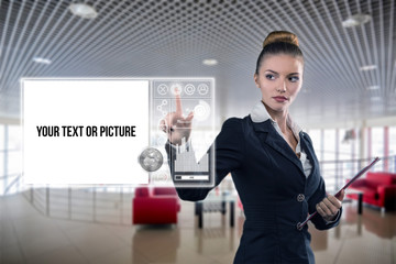 Young business lady works with virtual graphic interface in futuristic office