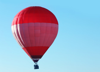 Naklejka premium Beautiful view of hot air balloon in blue sky. Space for text