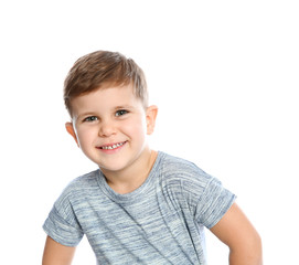 Portrait of little boy laughing on white background